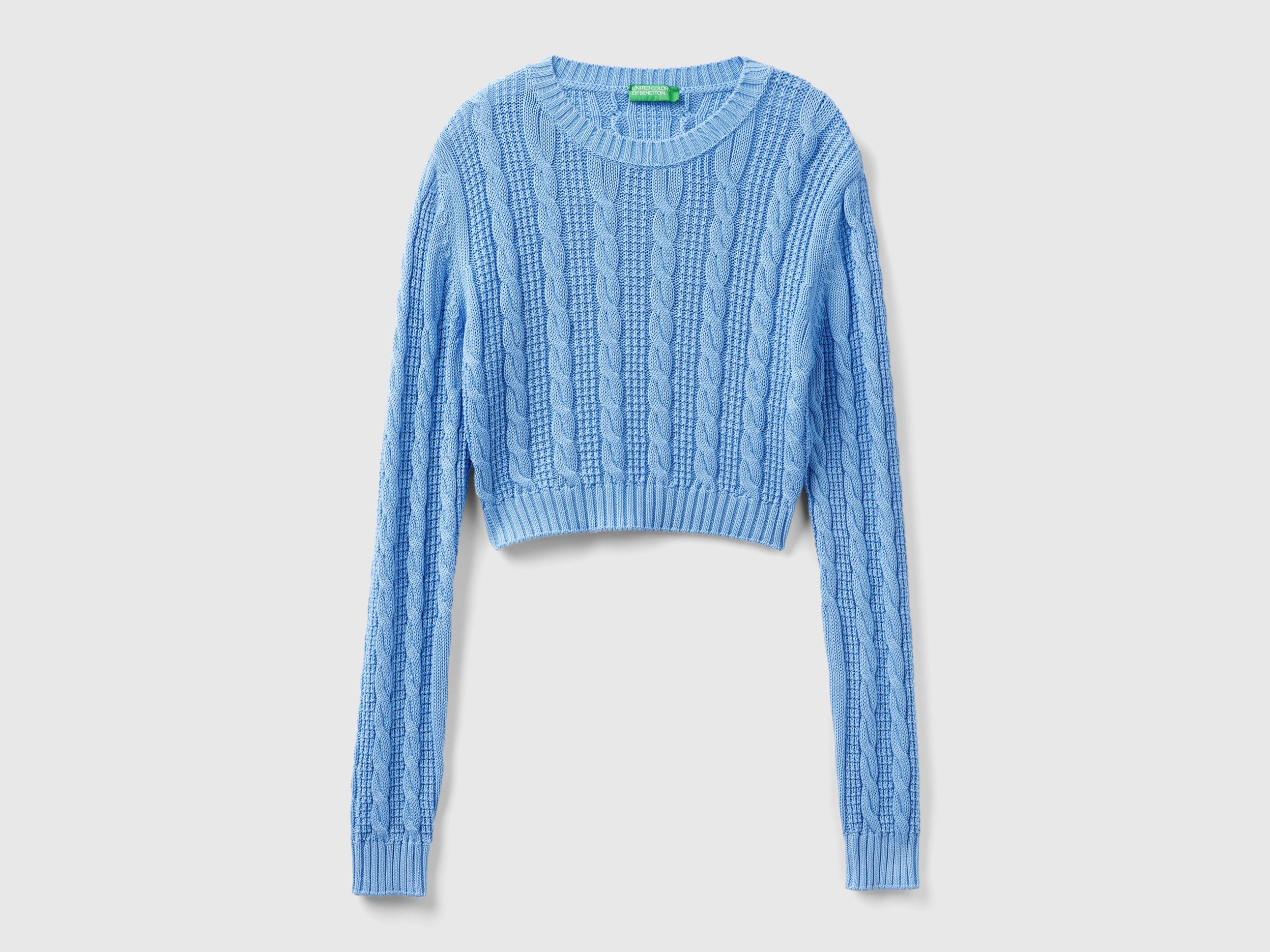Maglia cropped a trecce
