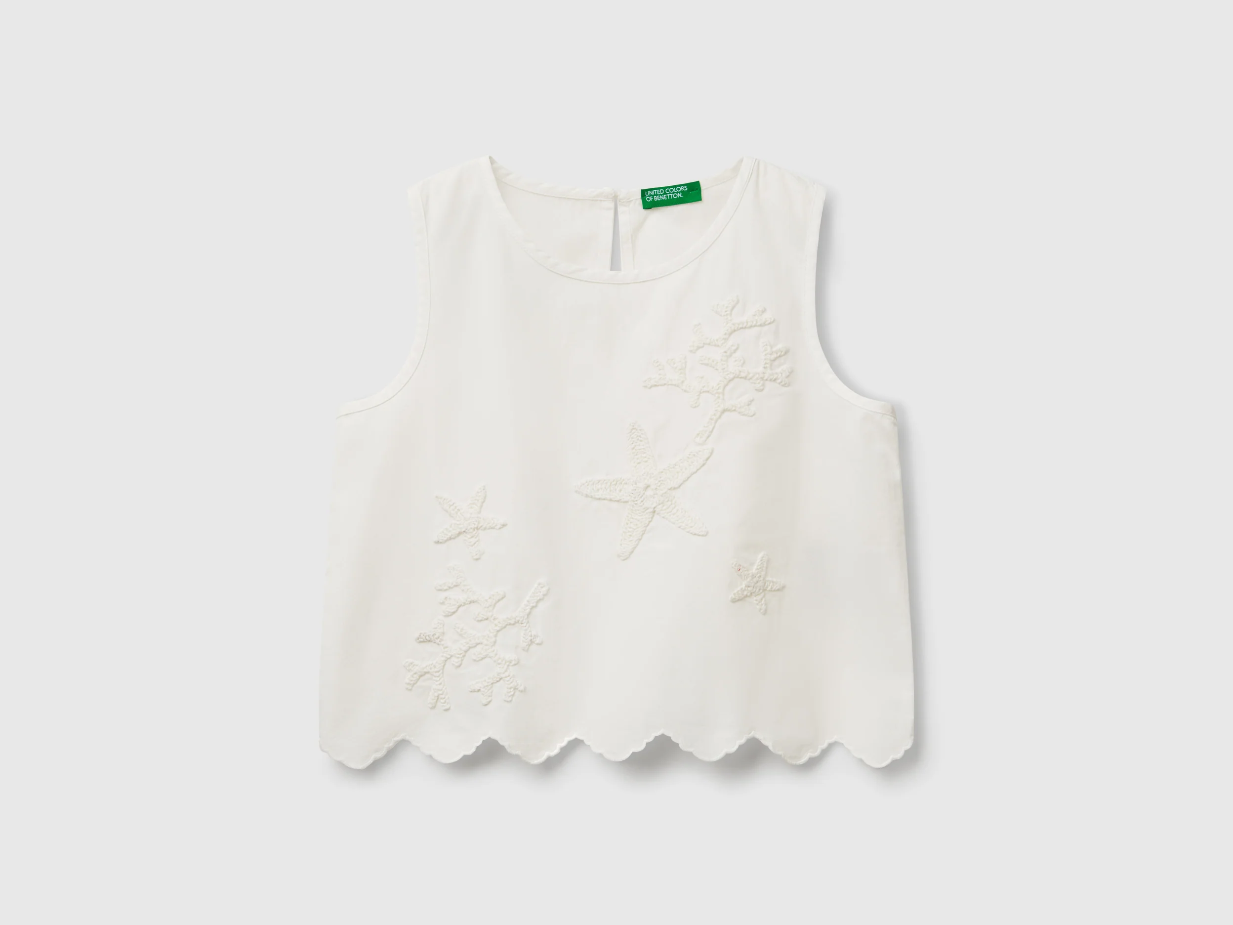 Top con patch crochet