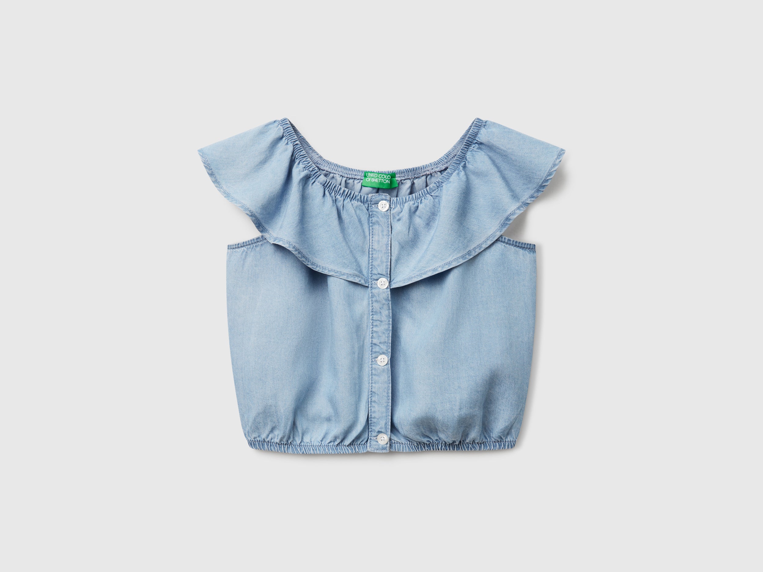 Top in chambray con volant